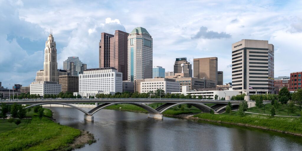 City skyline over a river on a sunny day