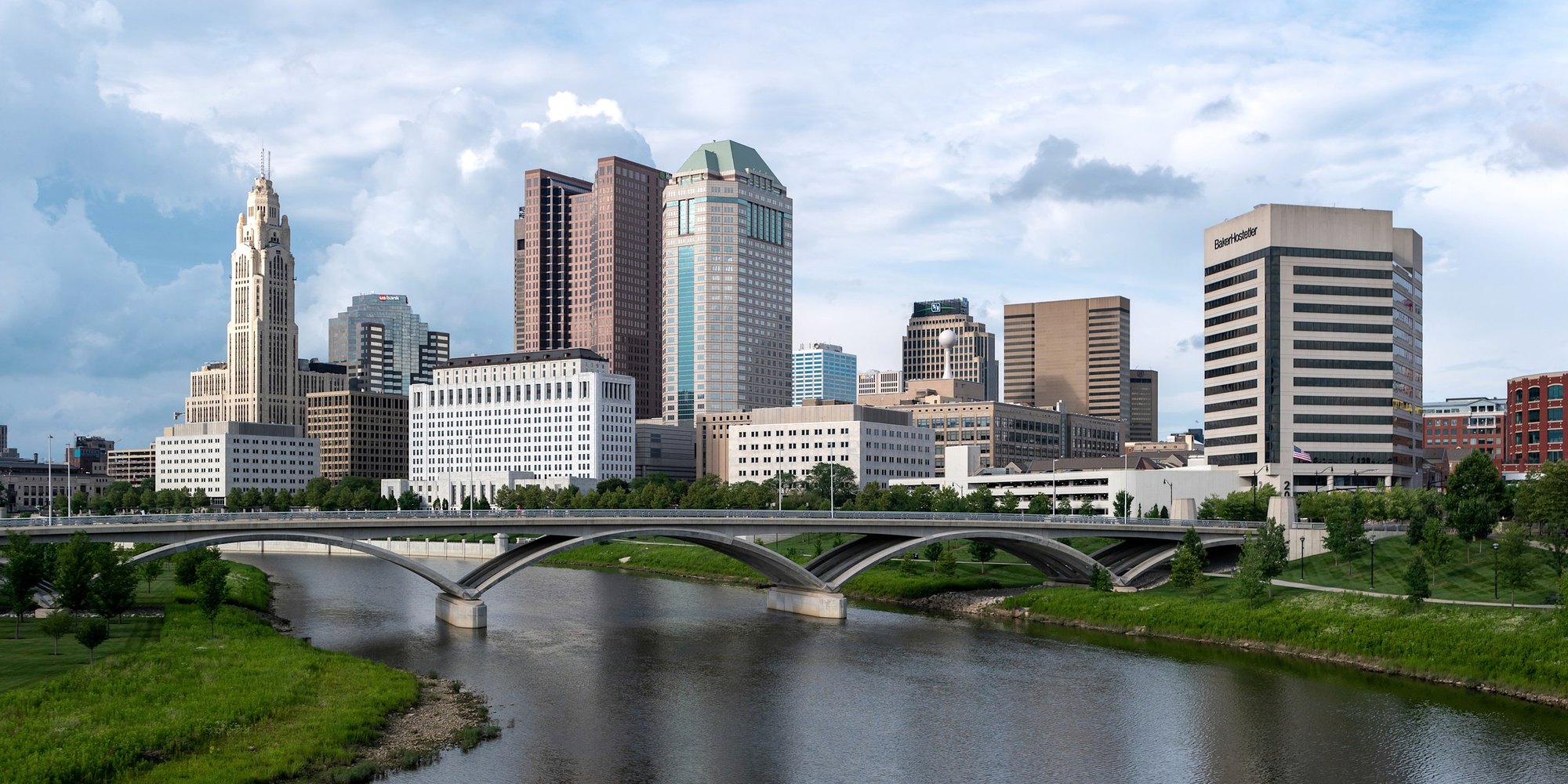 City skyline over a river on a sunny day